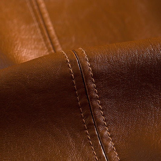 Wessel leren jas liggend op een neutrale achtergrond, toont de volledige kleurenselectie: cognac, bordeaux, blauw en zwart.