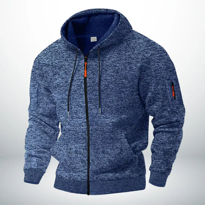 Zijaanzicht van de Sebastiaan hoodie, met detail van de geribbelde manchetten en de subtiele gemêleerde afwerking van het katoenfleece.