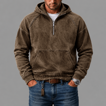 Detail van het label aan de binnenkant van de Dion denim hoodie, met zorginstructies in het Nederlands.