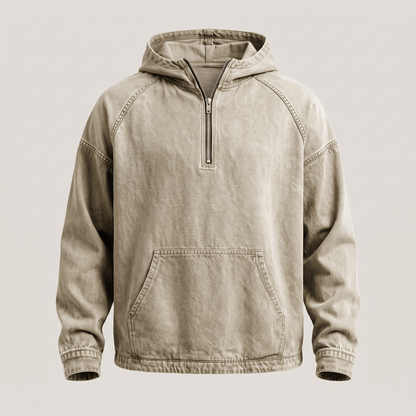 Man in de Dion hoodie in army groen, staand in een stedelijke omgeving, toont de veelzijdigheid.