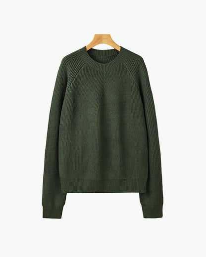 Zijaanzicht van de comfortabele katoenen sweater, toont de relaxed fit en geribbelde zoom.