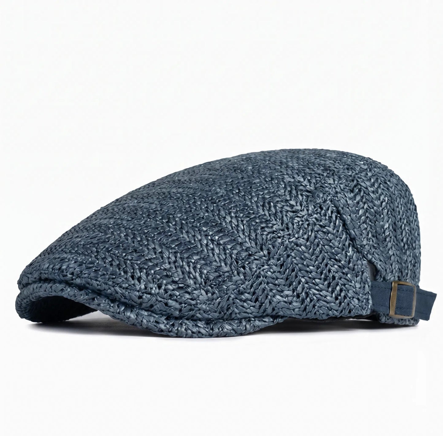 De zwarte Silas flatcap liggend op een lichte ondergrond, met focus op de luchtige structuur en het lage profiel.