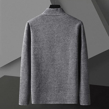 Detailopname van de mouw en manchet van het comfortabele gebreide herencardigan.