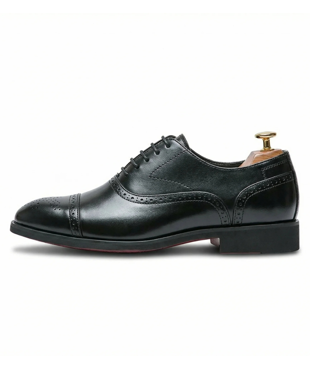 Gedetailleerde weergave van de textuur en stiksels van de premium leren Oxfordschoenen, gericht op het vakmanschap.