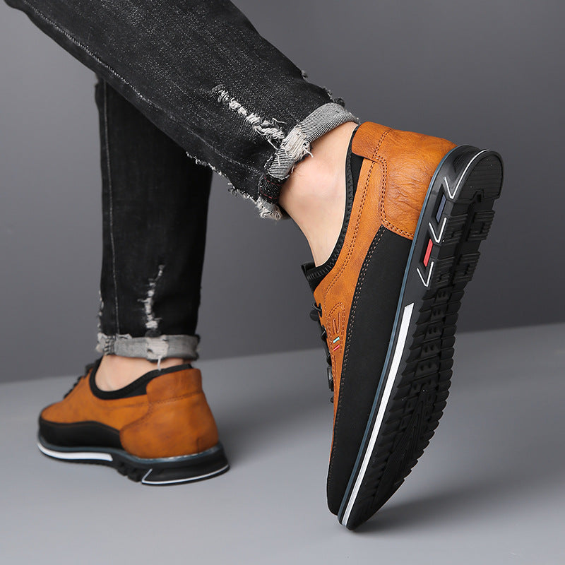 Gedetailleerde close-up van de veters en het leertextuur van de grijze Jorn Oxfordschoenen.