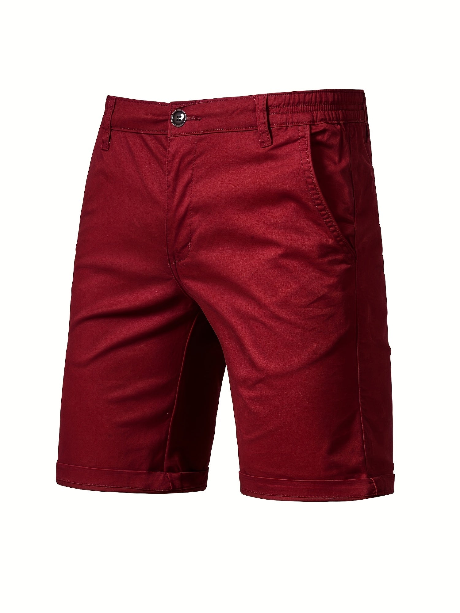Groene katoenen shorts, close-up van de tailleband en knoopsluiting.