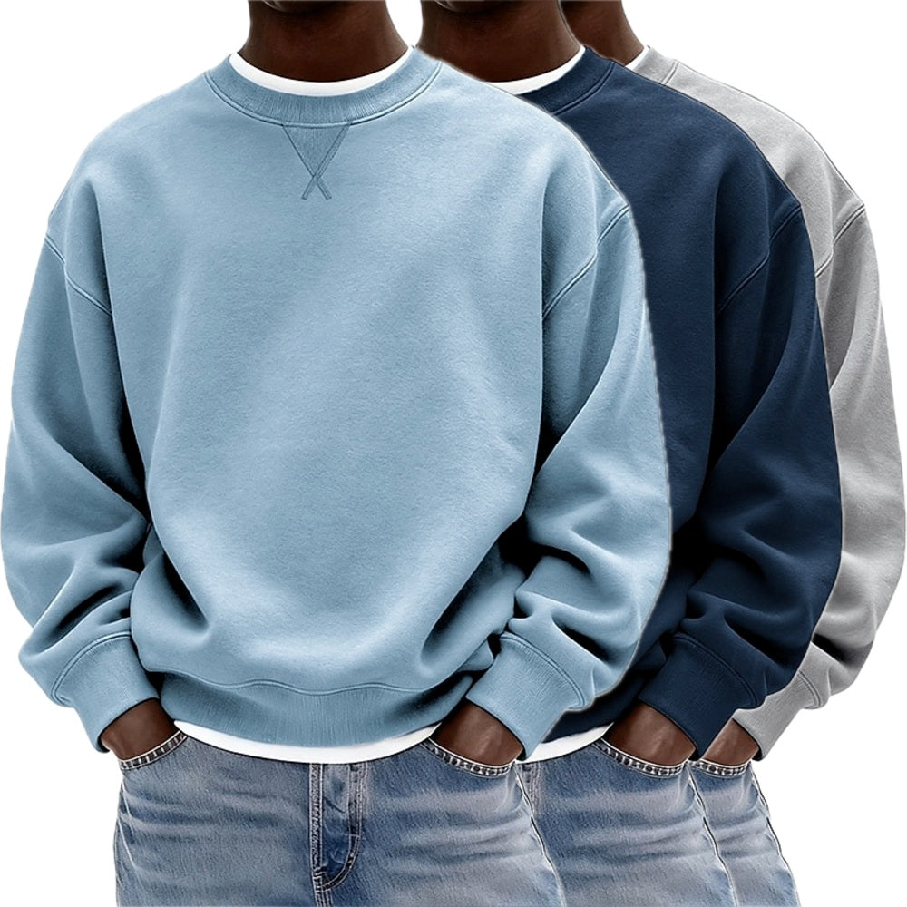 Detail van de mouwboord van de trui, met focus op de duurzame stiksels en de comfortabele pasvorm van de sweater.