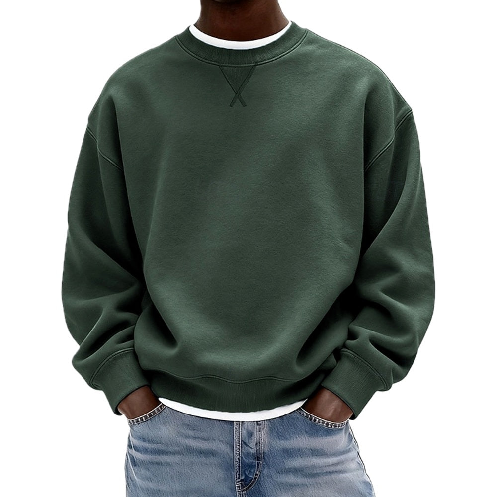 Detailopname van de stof van de zwarte sweater, met aandacht voor de zachte textuur en hoogwaardige afwerking.