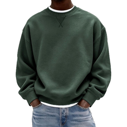 Detailopname van de stof van de zwarte sweater, met aandacht voor de zachte textuur en hoogwaardige afwerking.