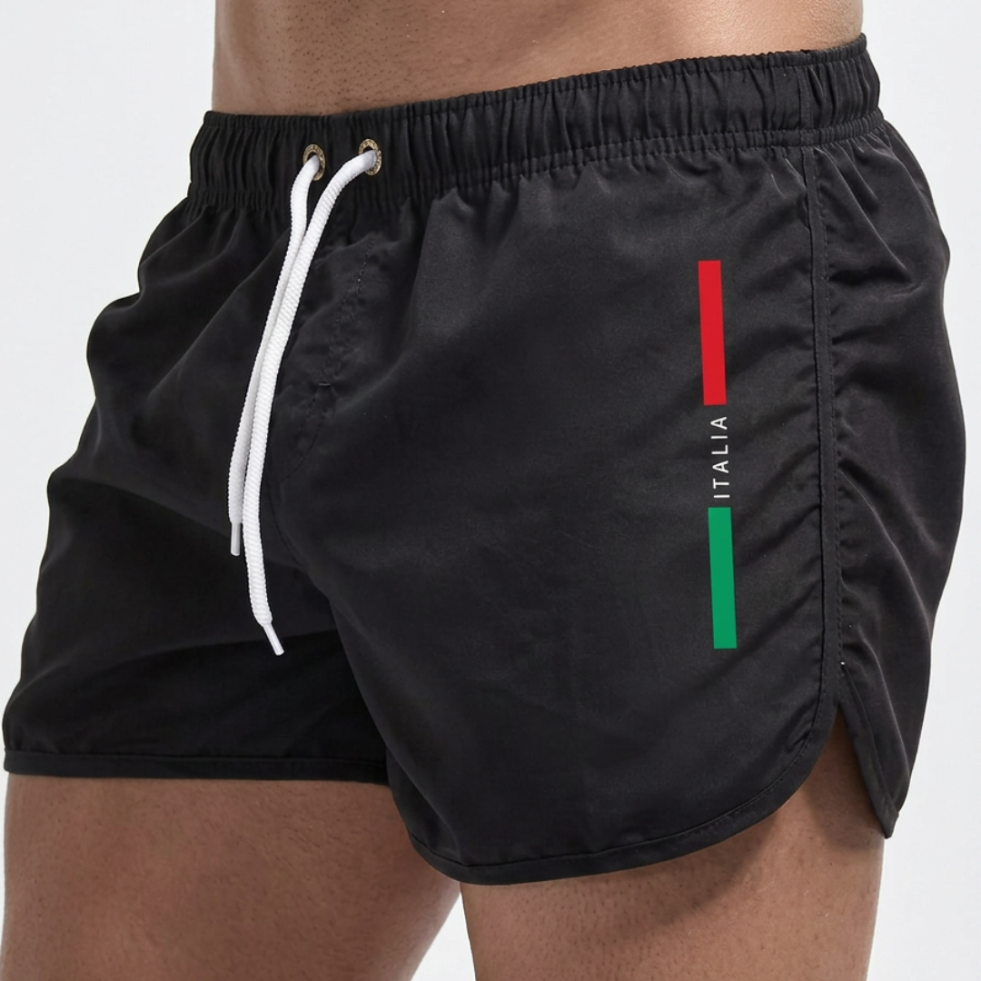 Zijaanzicht van de Otis zwemshort in een diepblauwe kleur, met de korte en sportieve snit duidelijk zichtbaar.
