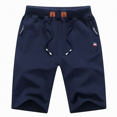 Detailopname van de tailleband van de Quinn shorts in marineblauw, met het verstelbare trekkoord en de stevige afwerking.